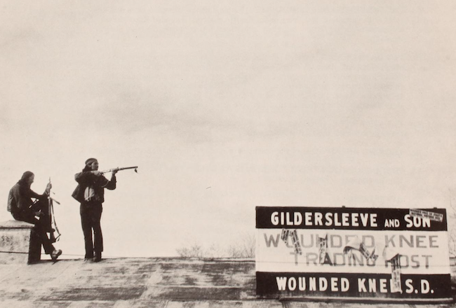 AIM activists stationed on rooftops at Wounded Knee, SD